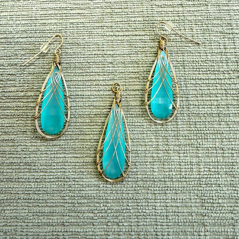 Artisan crafted/gold over sterling silver/ aqua color glass set.